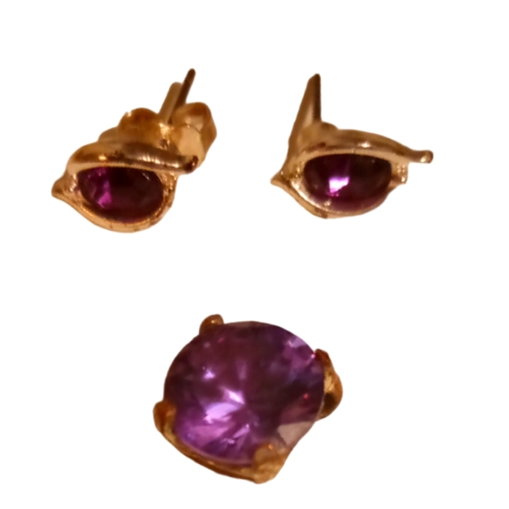 A set of purple stone earrings and a purple pendent to put on a necklace.